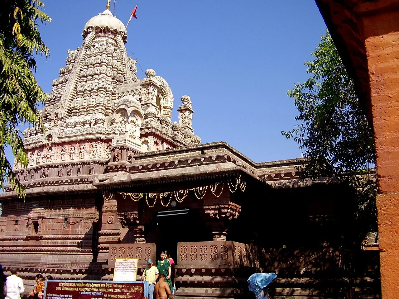 The carved spire and stone entrance of Grishneshwar Temple