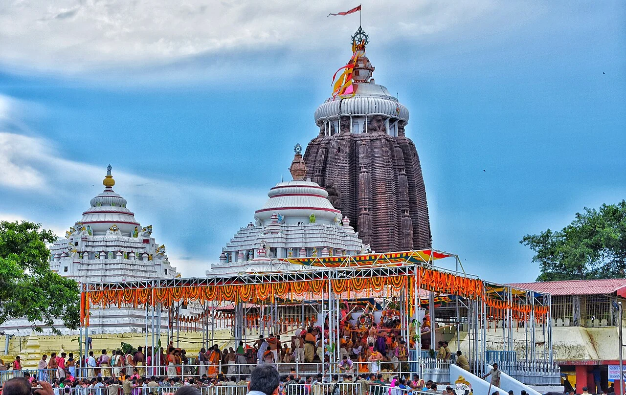 The spires of Jagannath Temple in Puri with decorations and devotees outside