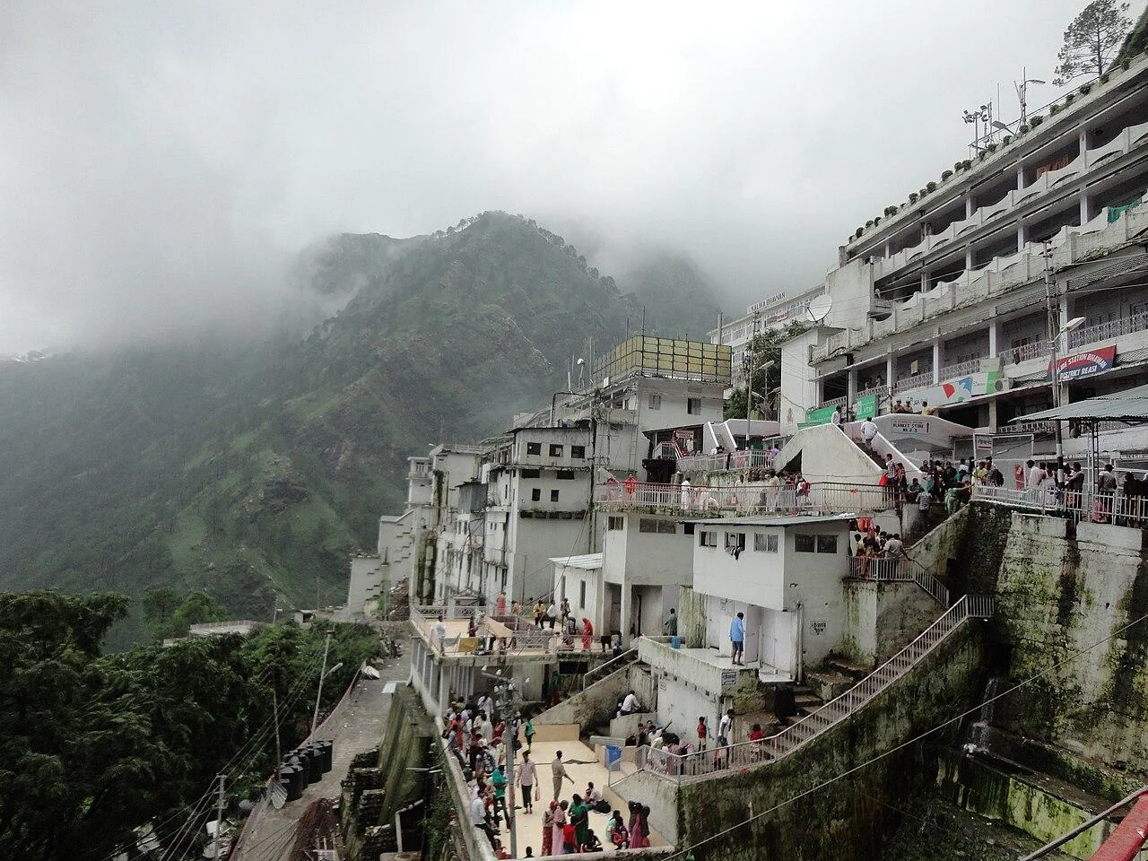 The Vaishno Devi Bhawan buildings along the mountainside in mist